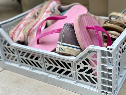A box to combat the jumble of shoes in front of the door.
