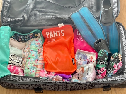 It’s best to roll clothes in packing cubes.
