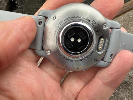 On the back is Garmin’s proprietary port for charging. You can also see the pulse and oxygen saturation sensors here.