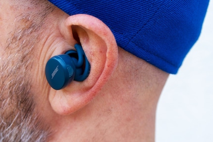 The Bose Sport Earbuds stick out of them by what feels like a foot.