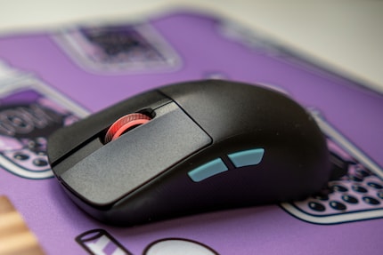 The side buttons on the Asus ROG Harpe Ace Aim Lab Edition stand out.