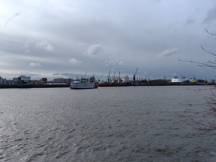 View across the Elbe of two ships and two music venues.