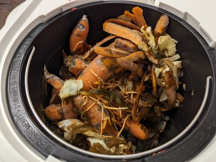Over a few days, I fill the Lomi with compostable kitchen scraps.