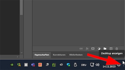 Klik op de ruimte naast de bel om alle vensters te minimaliseren of druk op Windows-toets + D.