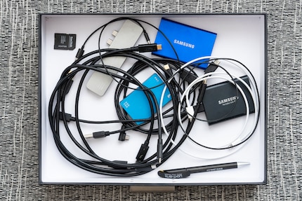 I hide cables, SSDs, card readers, pens and other small items in a drawer.