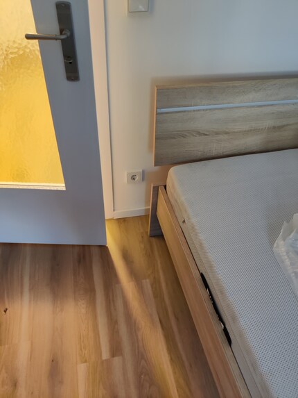 There's hardly any room for a bedside table between the door and my bed. But I want and need to have important things ready to hand for the night somewhere.