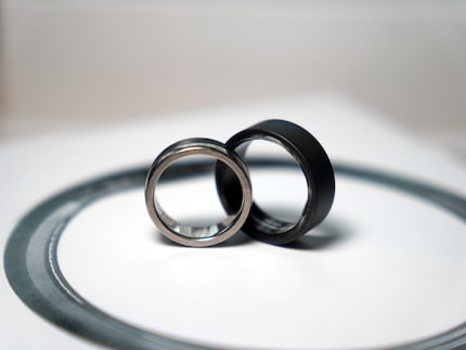 The Ultrahuman ring in size 10 compared to my wedding ring in size 9.