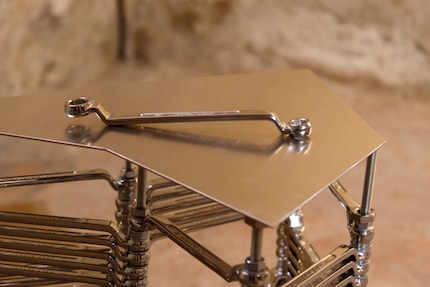 The pieces are made up of double ring spanners, screws, washers and hexagon nuts.
