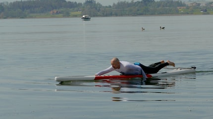 Enjoy the serenity on the water: prone paddling can be relaxed or hard work.