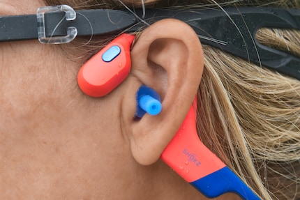 A treat for your ears. Even wearing swimming goggles and the earplugs provided, the headphones fit well.
