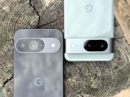 The black Pixel 9 and the light-green Pixel 8.