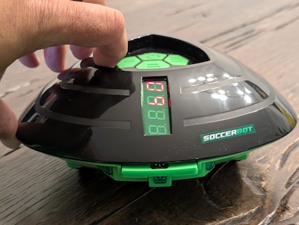 The infrared sensor and the contact bar are attached to the front of the robot.