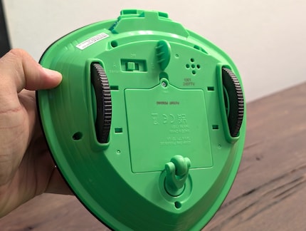 The robot races wildly after the ball on its wheels.