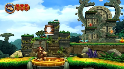 After pounding around the Donkey Kong field, a barrel appears to catapult me into the level’s background area.