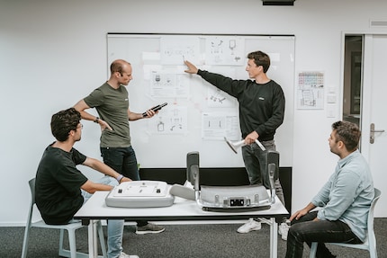 The Ofinto team tinkering with new features.