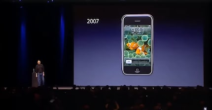 Steve Jobs with his magnum opus, the very first iPhone.