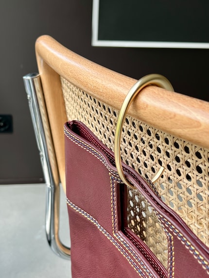 … and can even be attached to chair backs.