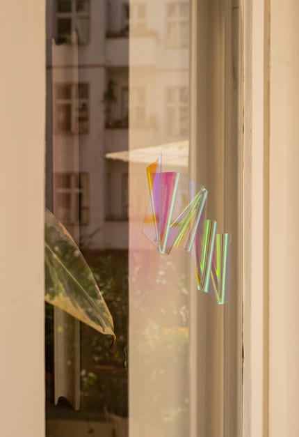 A suncatcher reflects the sun and creates colourful rainbow effects.
