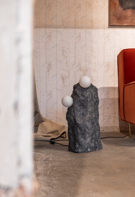 The Mutua lamp collection by Studio H. Fernández is made of handcrafted volcanic stone, stainless steel and opal glass.
