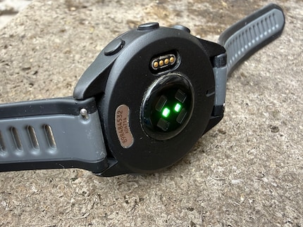 The connection for the Forerunner 165’s charging cable and sensors on its underside